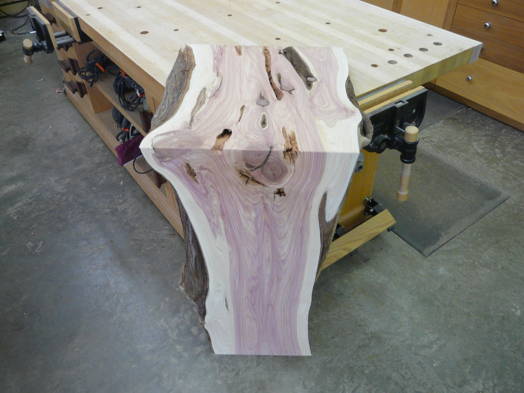 One live edge vanity with a waterfall edge.