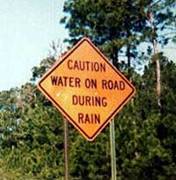 caution water on road during rain.jpg