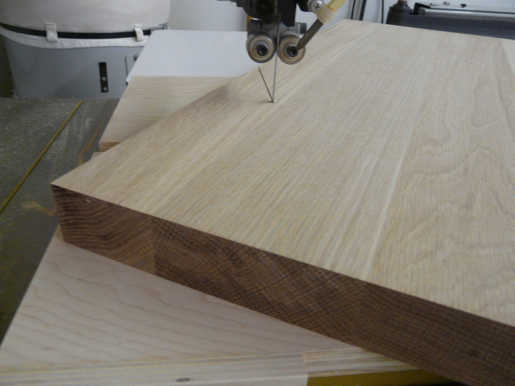 Now I just slide the jig and work piece along the miter slot into the blade.