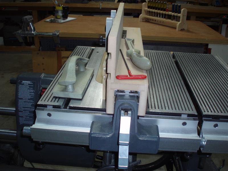 Bottom levers locks fence in position.  Top lever locks rear of fence.