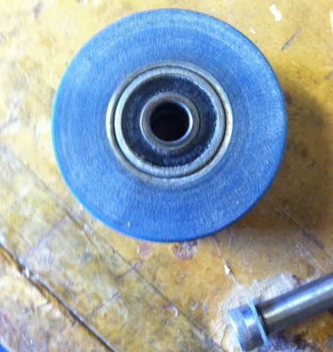 Shows washer on shoulder, shows bearing and steel wheel core