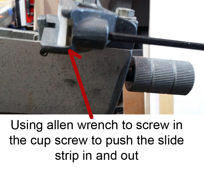 Using the allen wrench to screw the allen cup screw in and out, thus moving the slide strip back and forth to align the fence.