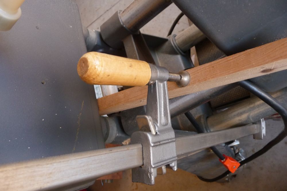 Cut the board so it is almost snug with the bandsaw. Less leverage is required.