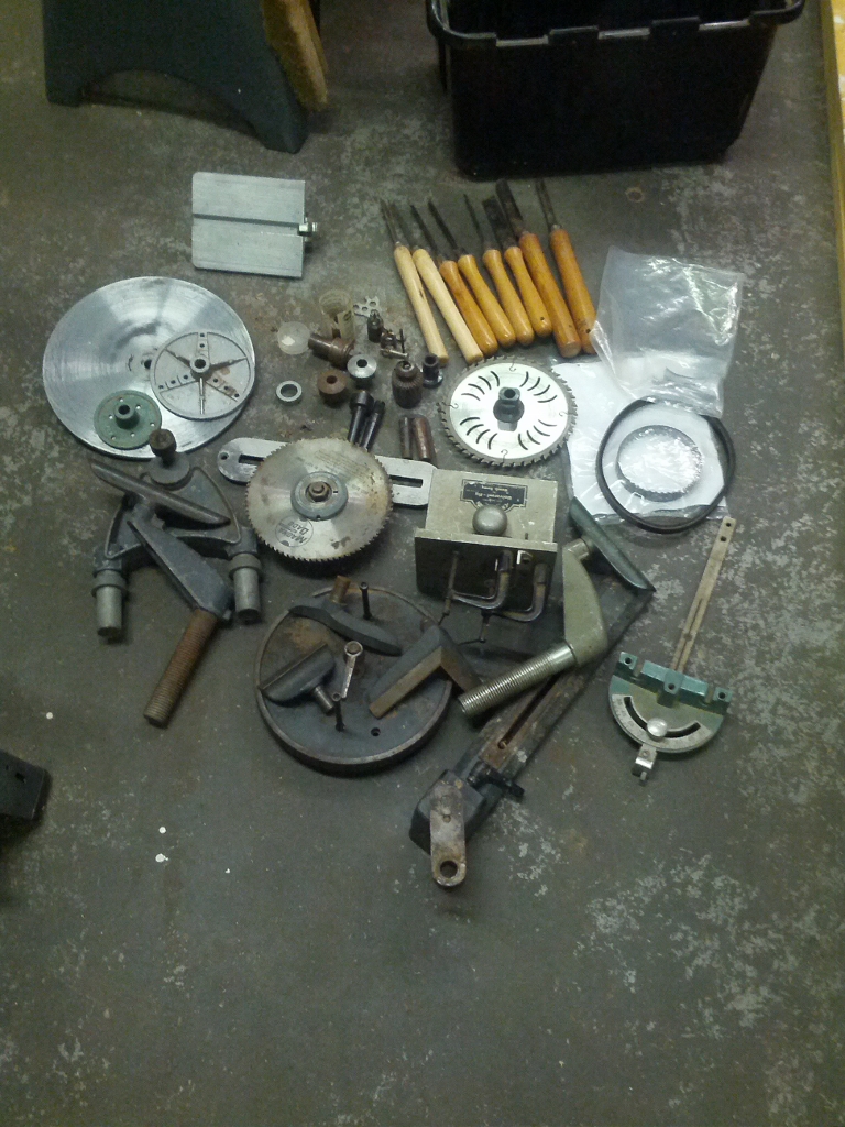 Box of extras with new belts, pork chop, and Universal Lathe Tool Rest