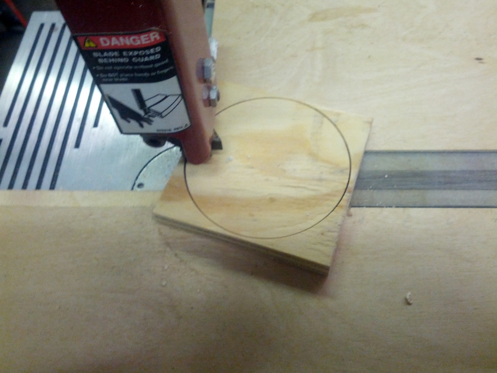 3/4" thick plywood cut to a 3 7/8" circle.  ID of 4" pipe may vary so check fit of circle and sheet metal and sand circle as needed.