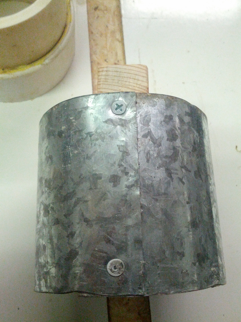 Countersink holes in wood circle and punch metal over hole then screw 120° apart.  Pop rivet other end.  With a 2 1/4" hole saw drill holes in two faces of hexagon.  Drill one of the holes with the metal sleeve inserted.