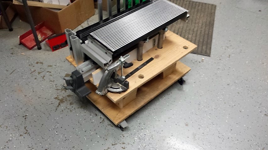 holds table extensions, bars, est. table,adj. supports, miter gauge, rip fence.(note holes to hold table when removed.