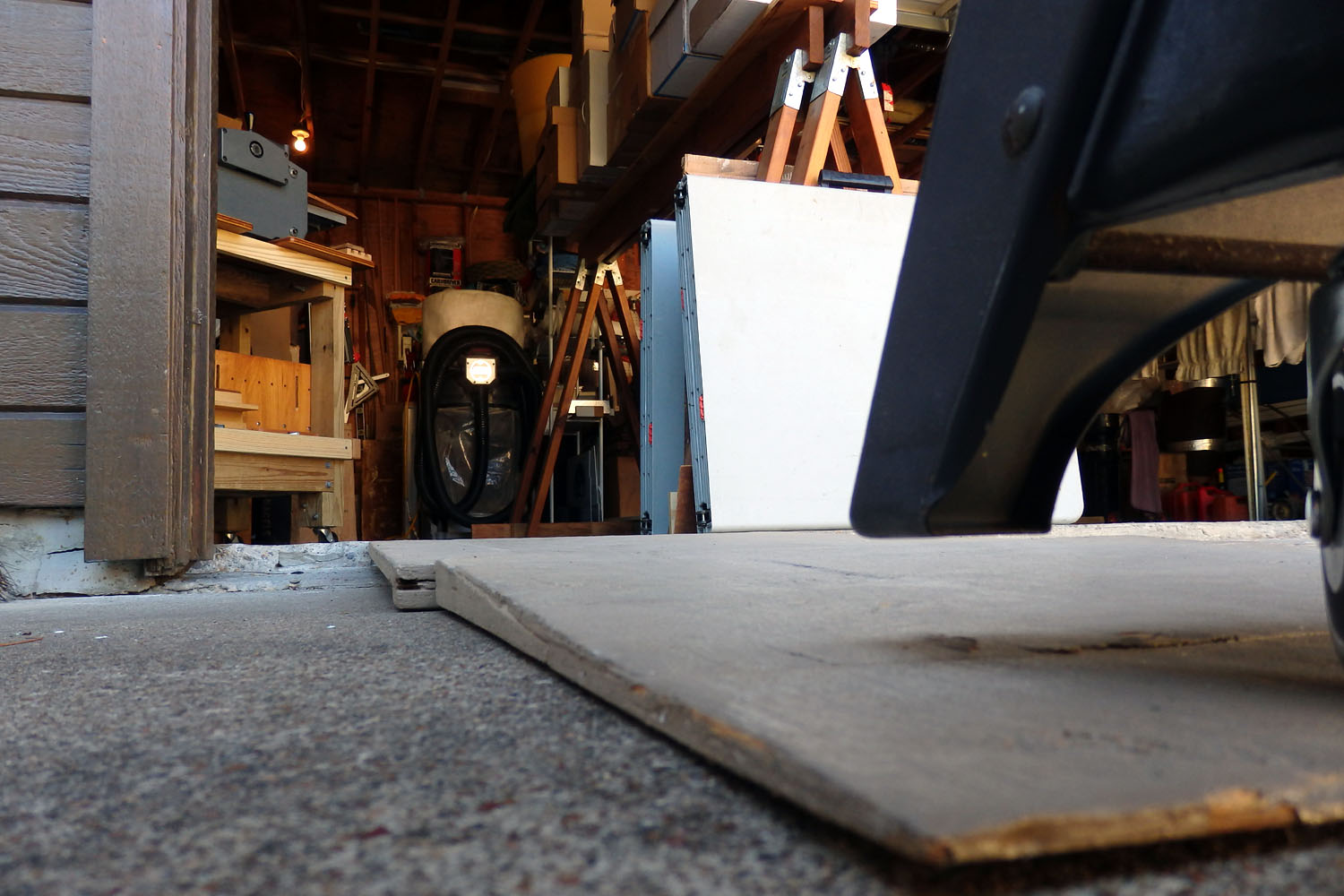 1-1/2" lip at garage door and two-piece plywood ramp (4'-6" total length)