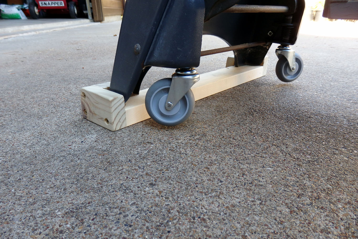 Wheels off ground, weight on wood support