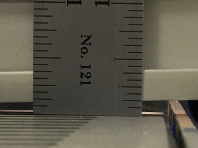Pressing down on front of table.