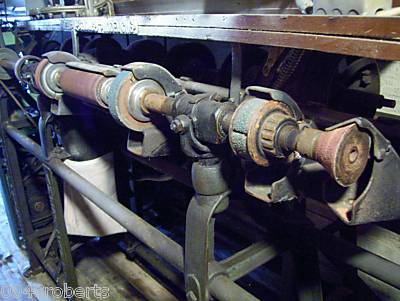 Close up of sanding wheels on another machine.JPG