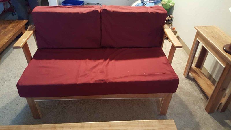 Husband made the cushion covers.  I made a small storage area under the seat cushion.