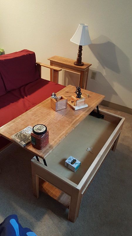 Coffee table opens for storage