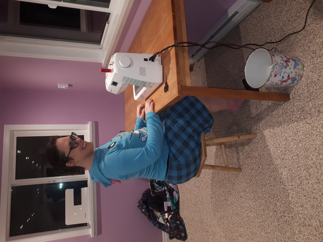 stool and daughter ready to sew.jpg
