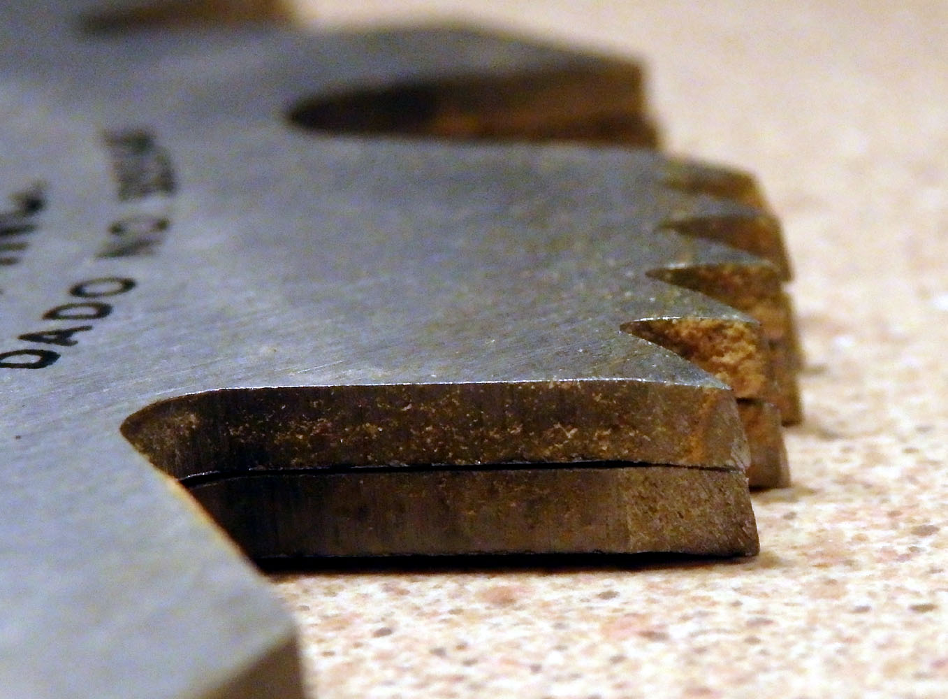 Two outer blades stacked with set of cross-cut teeth pointing in same direction (For this group of teeth, pointing down.  Next group will be pointing up.)