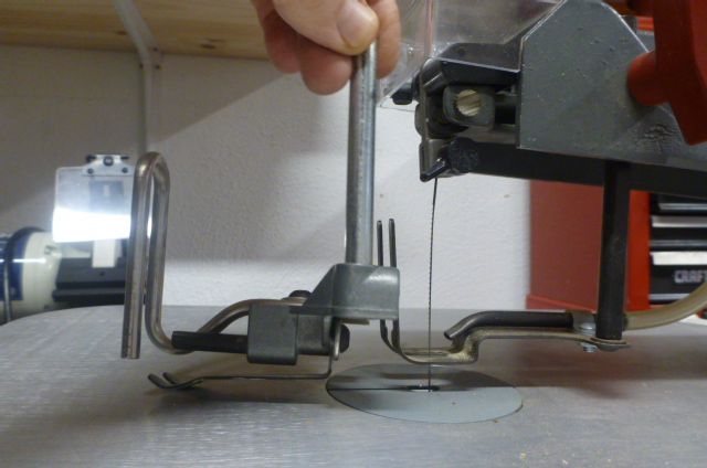 Comparison of old and new hold downs. New hold down is simpler but not better.