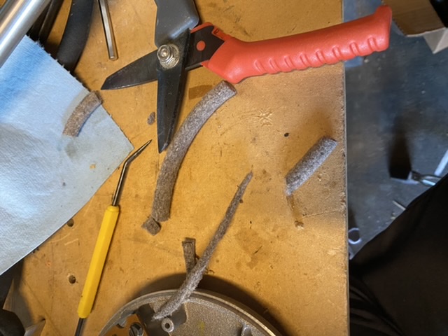 Cutting up the wool cord.