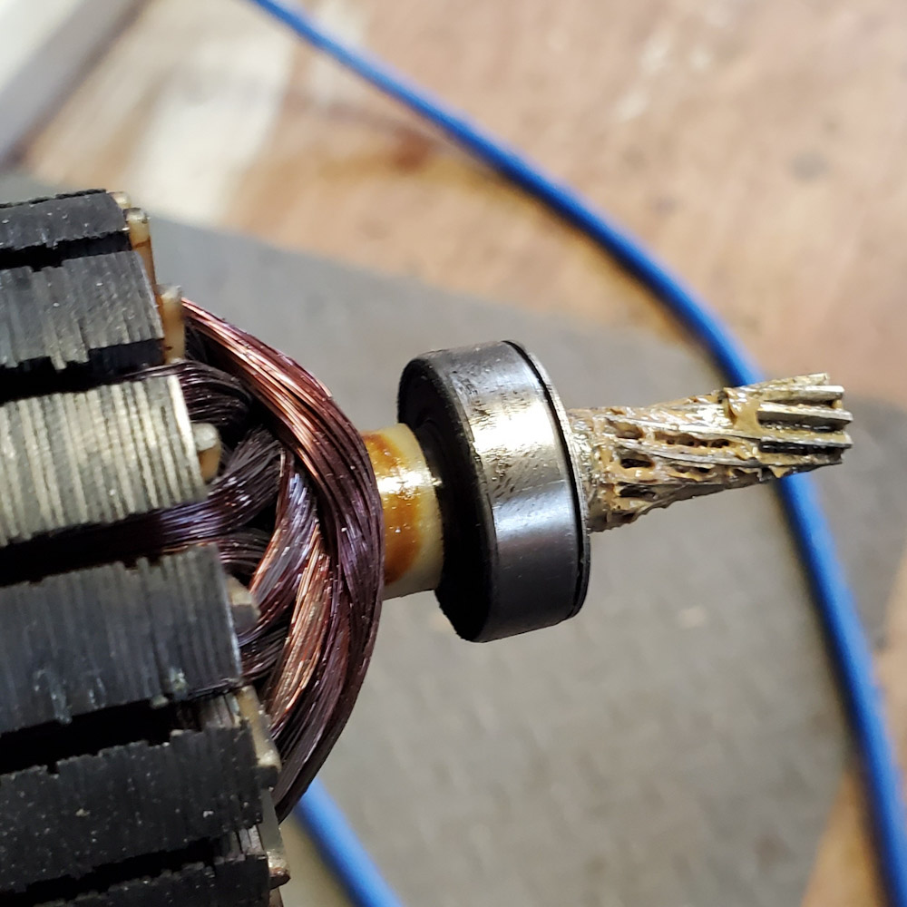 2 very thin washers at endnof armature