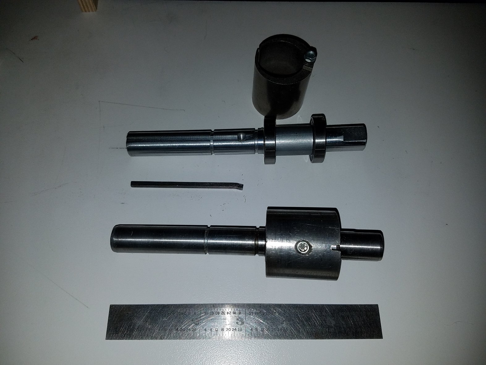 Old and New Idler Shafts with Key and Eccentric for New Indler shaft.