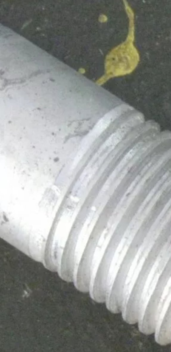 This is zoomed in on the same one that subsequently made me pull out my calipers and count the threads and found out that its just a piece of 1-1/4 8tpi threaded thick wall pipe with a groove turned in it for a set screw.