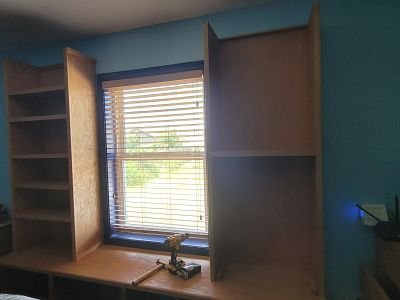 Right bookcase installed waiting for adjustable shelves.