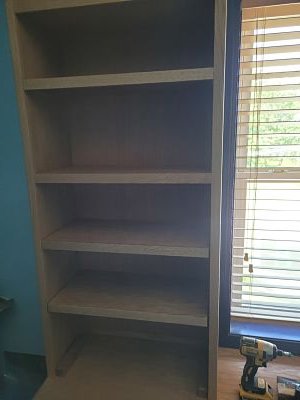 Left hand bookcase and adjustable shelves installed.