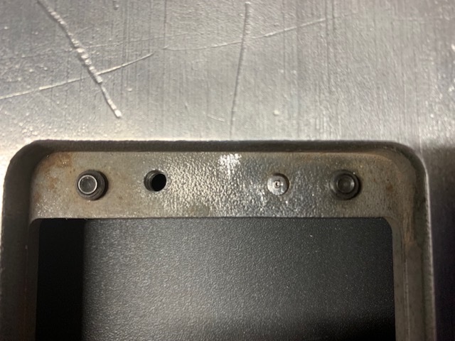 Table insert retaining screw filed and center-punched.
