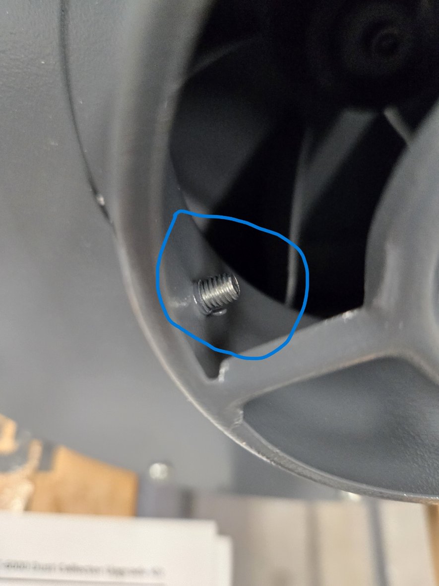 Screw protruding into inlet.