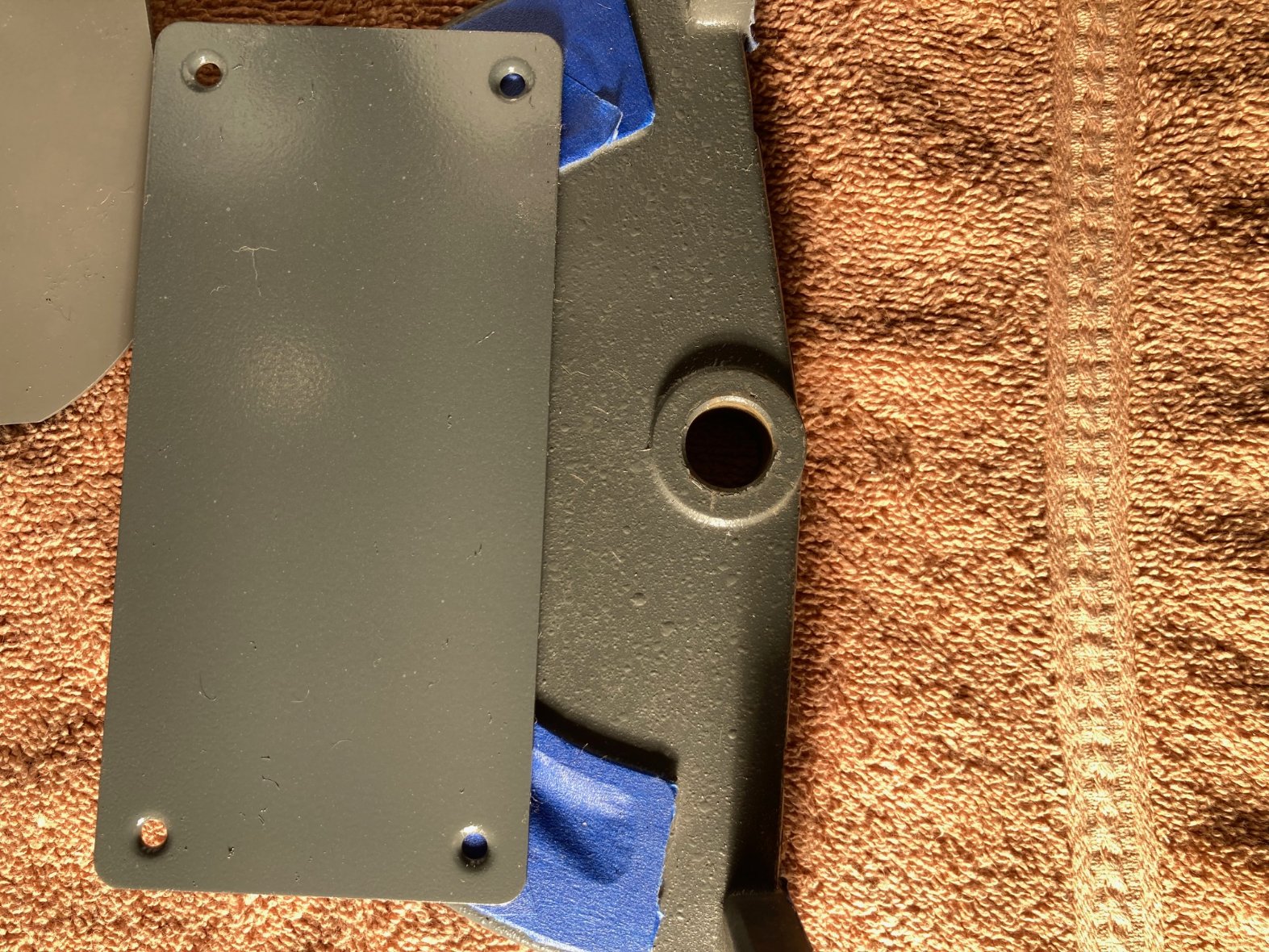 Close-up of SS touch-up paint and SS original factory-painted part
